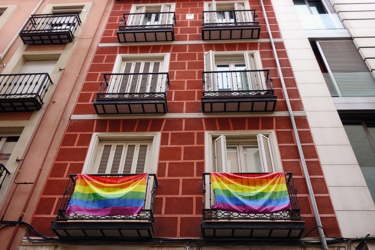 Rainbow flags on the balconies of a house in the Chueca district in Madrid, Spain