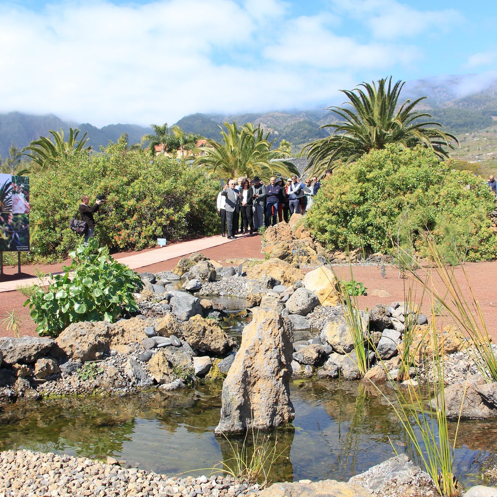 A tour group explores the botanical wonders of the gardens around the Pyramids of Guimar.