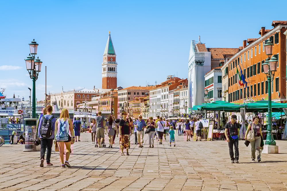 Tourists get around Venice by walking and the view on Grand Channel