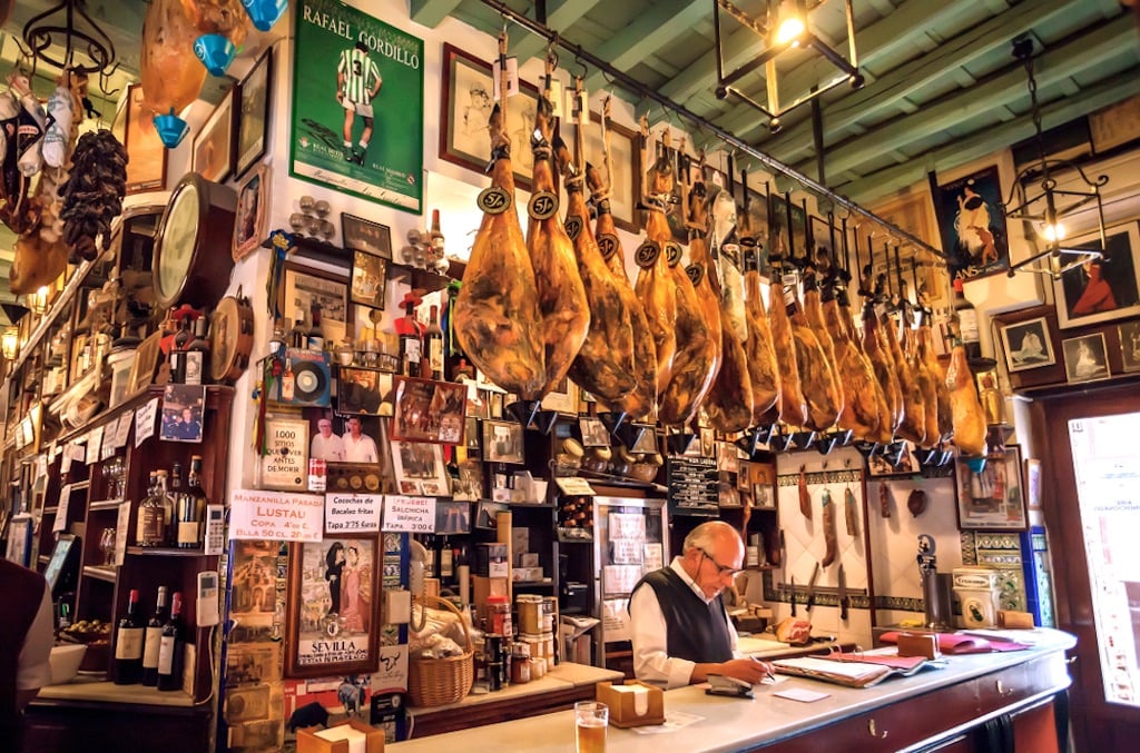 During your days in Seville, try a local car and enjoy delicious tapas!
