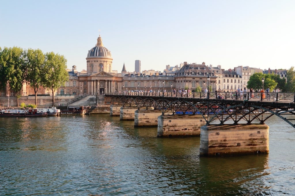 Walk further and pass the Pont des Arts bridge in Paris. 