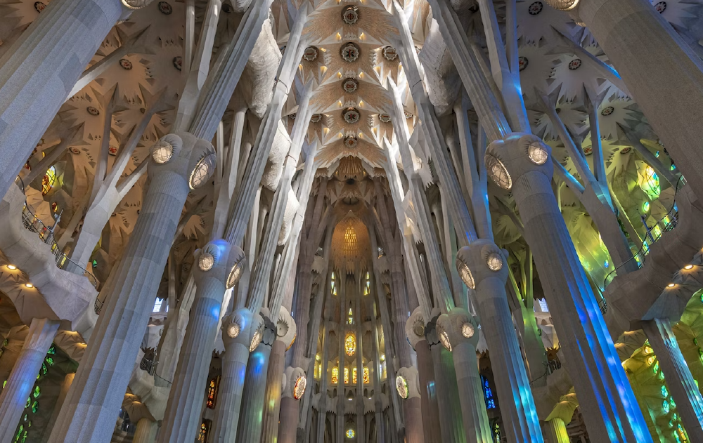 Interior of Sagrada Familia and the ceiling seen from below.