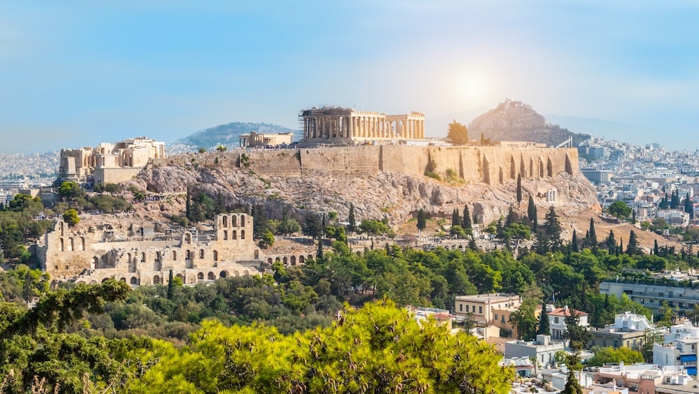 Panoramic view of Athens with Acropolis hill on a hot summer day in Greece.