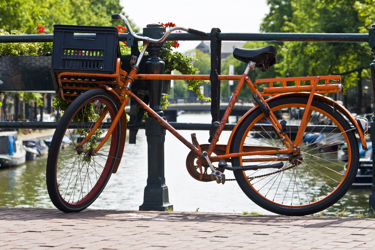 Orange bike on the canal